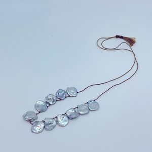 Lena Skadegard pearls strung on silk cord.